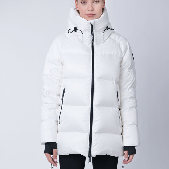 Orsa Women's Hooded Winter Coat – sustainable outerwear made from 100% recycled materials with repurposed down insulation.
