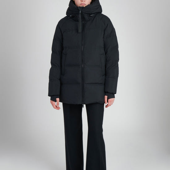 Orva Women's Down Puffer Coat – sustainable winter outerwear made from 100% recycled materials with repurposed down insulation.