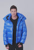 Video of man wearing down-filled winter coat in glossy bright blue with inner pockets and oversized hood.